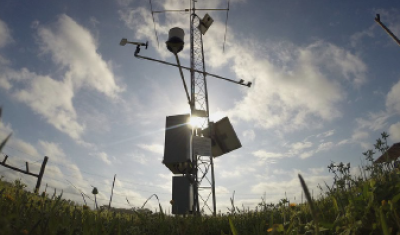 Sunny day looking at a mesonet tower