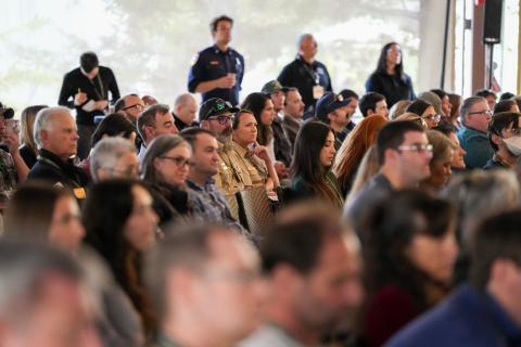 An engaged crowd watches the day's speakers.