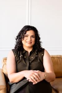 Woman curly hair sitting on couch