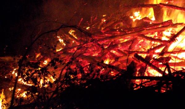 brush pile fire at night